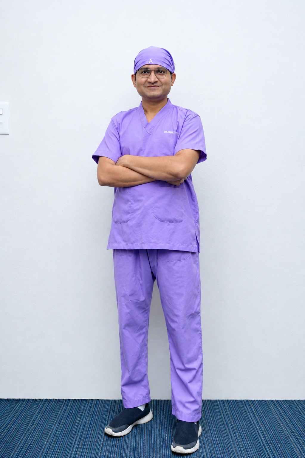 Dr. Anand Partani in surgical scrubs