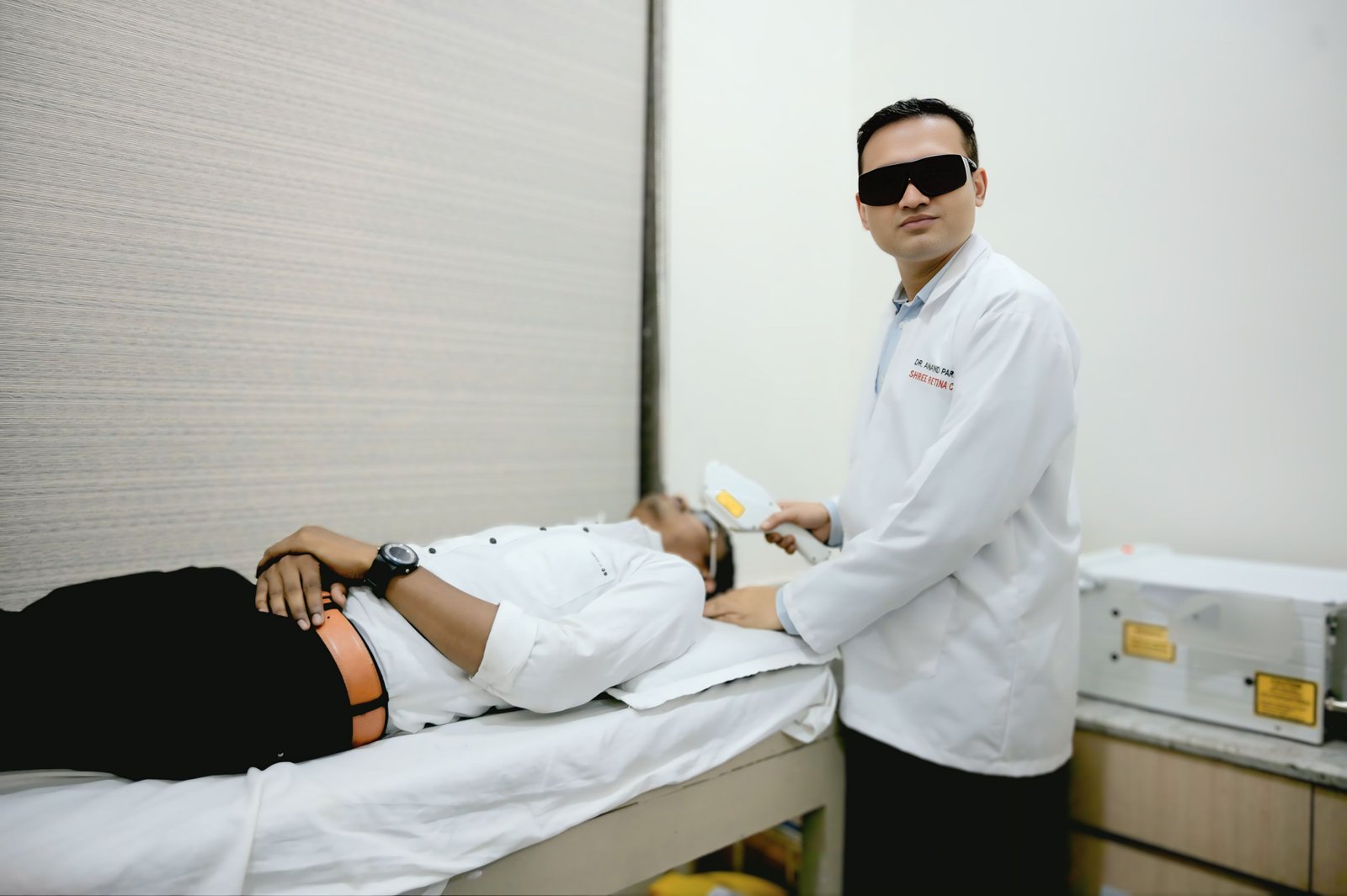 Doctor using laser equipment for eye care